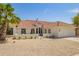 Charming single-story home with a well-manicured yard and a neutral color palette at 10155 E Wood Dr, Scottsdale, AZ 85260