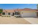 Charming single-story home with a well-manicured yard and a neutral color palette at 10155 E Wood Dr, Scottsdale, AZ 85260