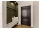 Mud room area with coat rack and bench seat in entryway at 10155 E Wood Dr, Scottsdale, AZ 85260