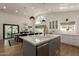 Bright eat-in kitchen features stainless steel appliances, an island, ample storage, and great natural light at 10155 E Wood Dr, Scottsdale, AZ 85260