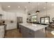 Stylish eat-in kitchen with island seating, stainless steel appliances, and quartz countertops at 10155 E Wood Dr, Scottsdale, AZ 85260