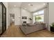 Bright living room with vaulted ceilings, fireplace, and large windows at 10155 E Wood Dr, Scottsdale, AZ 85260
