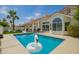 Outdoor pool area featuring a pristine pool, patio, and lush landscaping at 10155 E Wood Dr, Scottsdale, AZ 85260