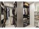 Organized walk-in closet featuring custom shelving, drawers, and ample storage at 10155 E Wood Dr, Scottsdale, AZ 85260