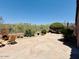 Desert backyard featuring a stone-paved patio area with partial mountain views at 10572 E Autumn Sage Dr, Scottsdale, AZ 85255
