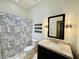 Updated bathroom featuring a granite vanity top and modern black fixtures at 10572 E Autumn Sage Dr, Scottsdale, AZ 85255