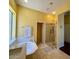 This bathroom boasts a glass-enclosed shower, separate tub, and tile flooring at 10572 E Autumn Sage Dr, Scottsdale, AZ 85255