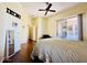 Spacious bedroom with hardwood floors and sliding door to outdoor space at 10572 E Autumn Sage Dr, Scottsdale, AZ 85255