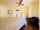 Bright, cozy bedroom with hardwood floors and neutral paint at 10572 E Autumn Sage Dr, Scottsdale, AZ 85255