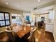 Open-concept dining area flowing into a modern kitchen and a cozy living area at 10572 E Autumn Sage Dr, Scottsdale, AZ 85255