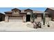 Inviting home featuring desert landscaping, a tile roof, and a two car garage at 10572 E Autumn Sage Dr, Scottsdale, AZ 85255