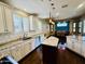 Bright kitchen with granite countertops, a central island, and modern appliances at 10572 E Autumn Sage Dr, Scottsdale, AZ 85255