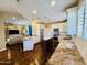 Modern kitchen with granite countertops, a center island, and stainless steel appliances at 10572 E Autumn Sage Dr, Scottsdale, AZ 85255