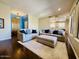 Cozy living room featuring hardwood floors, neutral paint, and comfortable seating at 10572 E Autumn Sage Dr, Scottsdale, AZ 85255