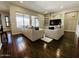 Bright living room with hardwood floors and plush seating and lots of light at 10572 E Autumn Sage Dr, Scottsdale, AZ 85255