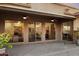 Spacious covered patio with ceiling fans and multiple sliding glass doors for seamless indoor/outdoor living at 11193 N 121St Way, Scottsdale, AZ 85259