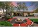 Well-maintained backyard with desert landscape, fire pit, outdoor seating, and expansive patio at 11193 N 121St Way, Scottsdale, AZ 85259