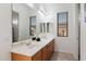 Bright bathroom features double sinks and a large mirror at 11193 N 121St Way, Scottsdale, AZ 85259