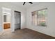 Bedroom featuring large window, carpet flooring, and walk-in closet at 11193 N 121St Way, Scottsdale, AZ 85259