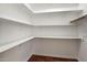 Walk-in closet features custom white shelving and storage at 11193 N 121St Way, Scottsdale, AZ 85259