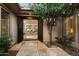 Stunning home entrance with double doors, an open view into the living space, and lush landscaping visible at 11193 N 121St Way, Scottsdale, AZ 85259