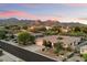 Inviting single-story home boasting lush landscaping, a tiled roof, and a spacious driveway at 11193 N 121St Way, Scottsdale, AZ 85259
