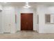 Elegant foyer featuring a grand double door, neutral colors, and tile flooring that creates a welcoming ambiance at 11193 N 121St Way, Scottsdale, AZ 85259