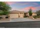 Lovely home with a three-car garage, desert landscaping, and stone accents enhancing its curb appeal at 11193 N 121St Way, Scottsdale, AZ 85259