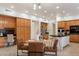 Spacious eat-in kitchen with wooden cabinetry, stainless steel appliances, and a breakfast bar with seating at 11193 N 121St Way, Scottsdale, AZ 85259