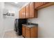Laundry room features a sink and front loading washer/dryer at 11193 N 121St Way, Scottsdale, AZ 85259