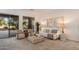 Bright living room with stylish seating, neutral decor, and access to the outdoor patio at 11193 N 121St Way, Scottsdale, AZ 85259