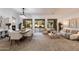Open-concept living and dining area with large windows offering backyard views, perfect for gatherings and relaxation at 11193 N 121St Way, Scottsdale, AZ 85259
