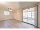 Living area featuring sliding glass door, and neutral walls and floors at 1124 S Longwood Loop, Mesa, AZ 85208