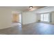 Bright living area with wood-look floors, large window, and access to the patio at 1124 S Longwood Loop, Mesa, AZ 85208