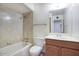 This bathroom features a bathtub and shower combo, toilet, vanity and mirror at 12220 N 22Nd Pl, Phoenix, AZ 85022