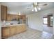 Large open kitchen featuring oak cabinets, tile flooring, and ample counter space at 12220 N 22Nd Pl, Phoenix, AZ 85022