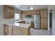 Well-equipped kitchen with oak cabinets, stainless steel appliances, and tile floors at 12220 N 22Nd Pl, Phoenix, AZ 85022