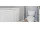 Powder room includes modern toilet and updated cabinets with tile floors at 12732 S 175Th Dr, Goodyear, AZ 85338
