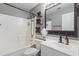 Well-lit bathroom with a tub-shower combination and woven basket storage at 12732 S 175Th Dr, Goodyear, AZ 85338