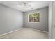 Comfortable bedroom with neutral carpet, ceiling fan, and bright window at 12732 S 175Th Dr, Goodyear, AZ 85338