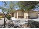 Charming home featuring stone accents, desert landscaping, and a well-manicured front yard at 12732 S 175Th Dr, Goodyear, AZ 85338