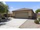 A well-maintained single-story home featuring a two-car garage and desert landscaping at 12732 S 175Th Dr, Goodyear, AZ 85338