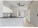 Updated kitchen featuring white cabinets, black countertops, and modern appliances at 12732 S 175Th Dr, Goodyear, AZ 85338