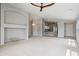 Spacious living area with vaulted ceilings, ceiling fan, open to the kitchen at 12732 S 175Th Dr, Goodyear, AZ 85338