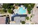 Aerial view of the community pool and amenity center with solar panels, surrounded by lush landscaping at 14870 W Encanto Blvd # 1038, Goodyear, AZ 85395