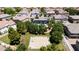 Aerial view showcases a community pool, clubhouse and basketball court, surrounded by lush landscaping at 14870 W Encanto Blvd # 1038, Goodyear, AZ 85395