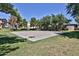 Outdoor basketball court in a grassy area, surrounded by mature trees in a Gathering-friendly neighborhood at 14870 W Encanto Blvd # 1038, Goodyear, AZ 85395