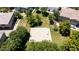 Aerial view of a community basketball court surrounded by lush greenery and residential properties at 14870 W Encanto Blvd # 1038, Goodyear, AZ 85395