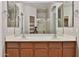 Spacious bathroom featuring dual vanity sinks and large mirrors at 14870 W Encanto Blvd # 1038, Goodyear, AZ 85395