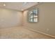 Bright, carpeted bedroom with window and ample natural light at 14870 W Encanto Blvd # 1038, Goodyear, AZ 85395